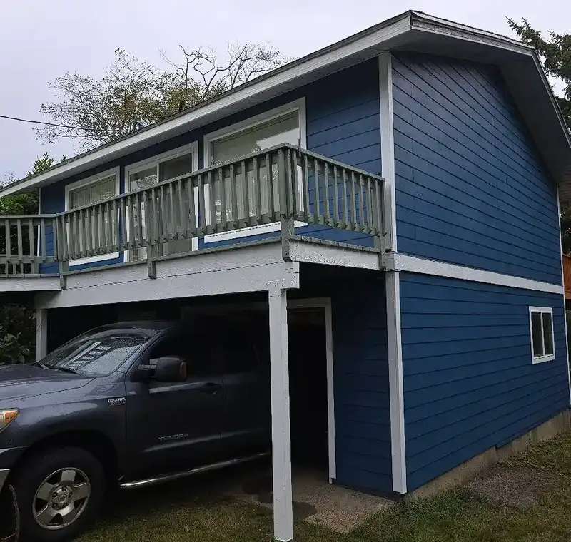 Randall J Banks hand-painting exterior trim on a craftsman home in Eugene Oregon — house painter with 40 years experience Randall J Banks hand-painting exterior trim on a craftsman home in Eugene Oregon — house painter with 40 years experience